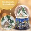 Snow globe Christmas music box, winter hut, base Christmas market