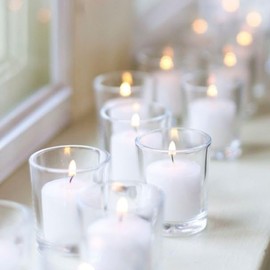 Set of 12 White Fresh Laundry Scented Richland Votive Candles and 12 Clear Glass Eastland Votive Holders