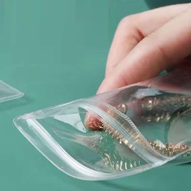 Small Plastic Bags, 100 Pcs Mini Baggies, Clear Plastic Jewelry Thick Self Sealing PVC Bags, Resealable Poly Baggies for Pill, Beads, Screws, Packaging (1.6x2.4"）