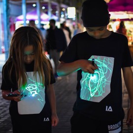 Illuminated Apparel Interactive Glow in The Dark T-Shirt - Fun for Birthday Parties & Festivals - Light up The Night (XXL, White/Pink Glow)