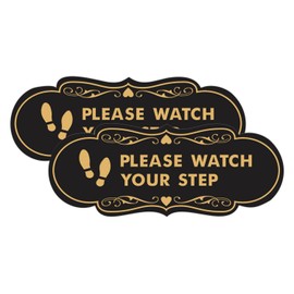 Señal de Designer Please Watch Your Step (huellas) (oro negro), grande (paquete de 2)
