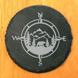 Slate Coasters: Wilderness Wonders - Laser Etched Nature Scene with Mountains, Trees, and Bear in Compass Center - Rustic Home Decor Gift - Round Slate - set of 6