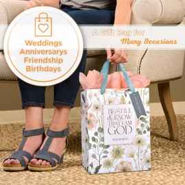 Christian Art Gifts Large Portrait Inspirational Scripture Gift Bag, Tag & Wrapping Tissue Paper Set for Women: Be Still Bible Verse Psalm, White Multicolor Floral & Gold Design, Satin Ribbon Handles