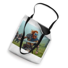 Proud Highlander stands defiant over misty Scottish hills Tote Bag
