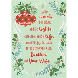 Designer Greetings Red Ornament, Sparkling White Ribbon, Holly and Pine Border on Light Green Christmas Card for Brother and Wife