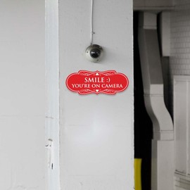 Signs ByLITA Designer Smile You're on Camera Sign - Easy Installation | Durable Wall or Door Sign (Black Gold) - Medium