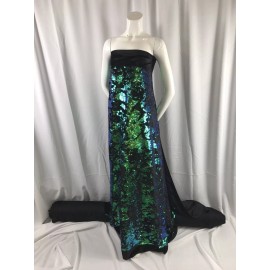 New Creations Fabric And Foam Inc GREEN IRIDESCENT SEQUINS ON A BLACK 2 WAY STRETCH VELVET-SOLD BY THE YARD.