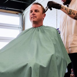 Barber Strong The Barber Cape Haircut Cover for Men, Hair Repelling and Static-Reducing Material, Flexible Elastic Neckband, Water Resistant Fabric, Oversized for Complete Coverage - Green Shield