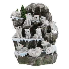 Ebros Gift 12 Miniature Arctic Wolf Pups On Snow Capped Wolf Den Rocky Cave Lair with Pine Trees Display Stand Sculpture with LED Back Light Set