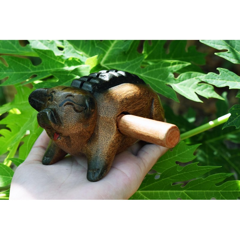 Guiro music percussion instruments wooden sound block animal croaking Pig