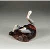 Brown Pelican Trio by John Perry Sculpture on burlwood base