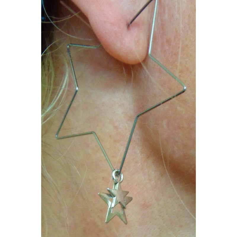 Delicate star hoop earrings made of stainless steel. Star-shaped large