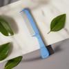 The Hair Doctor Handle Comb with silky smooth rotating teeth