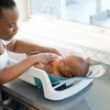 The First Years 4-in-1 Reclining Baby Bathtub - Adjustable Recline