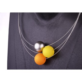 Adi-Modeschmuck 3-stranded necklace Mara, 20mm Polaris beads in saffron and yellow with a silver accent bead made of lacquered acrylic resin. Handmade by in Berlin
