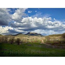 Photo- The distant Squaw Mountain looms over the Ladder Livestock Ranch near the tiny town of Savery, Wyoming, across the highway from which lie Colorado and the mountain 30in x 24in