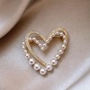 Broche de corazón con diamantes de imitación de oro con