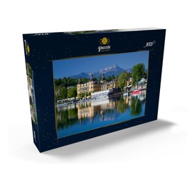 MyPuzzle Schlosshotel am See gegen Mittagskogel (2143m), Velden, Wörther See, Austria - Premium 1000 Piece Puzzle - MyPuzzle Special Collection by Puzzle Galaxy