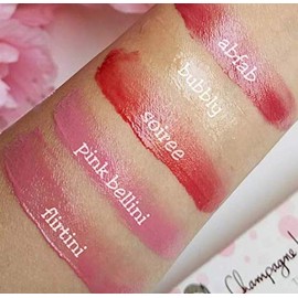 Lucie + Pompette Champagne Tinted Lip Balm infused with Natural Oils and Shea Butter in Soiree - Warm Red. Enhanced with a light champagne flavor.