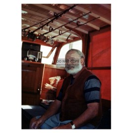 ERNEST HEMINGWAY SITTING ON YACHT WITH FISHING POLES 5X7 PHOTO