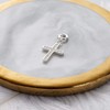 Philip Jones Cross Charm Created with Zircondia® Crystals