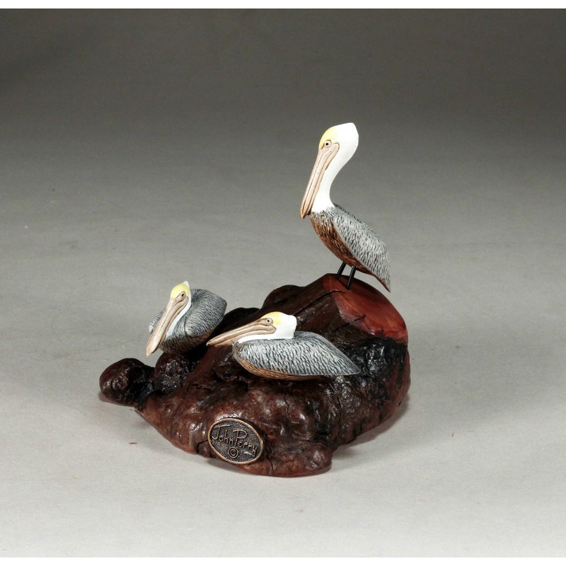 Brown Pelican Trio by John Perry Sculpture on Polished burlwood