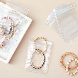 Stockroom Plus 100 Pack Clear Plastic Bags for Jewelry, Earrings, Necklaces, Mini Resealable Bags for Small Business (3.5 x 5.1 In)