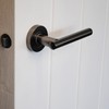 ONYX DESIGN Laurel Lever on Rose Door Handle in Gunmetal