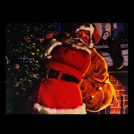 Northlight LED Lighted Jolly Santa Claus with Bag of Gifts Christmas Canvas Wall Art 11.75" x 15.75"