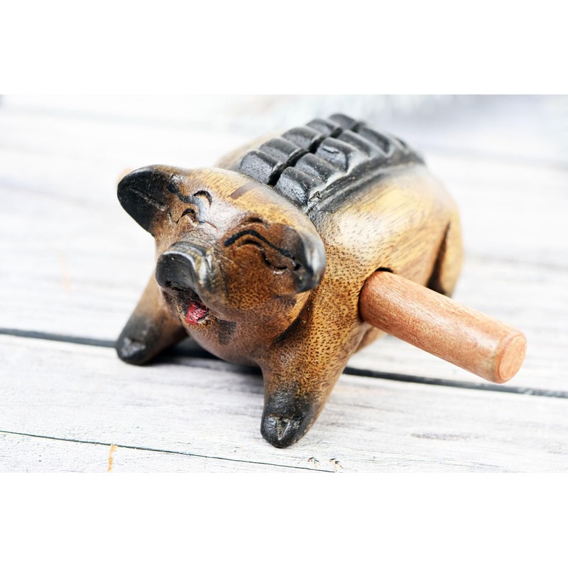 Guiro music percussion instruments wooden sound block animal croaking Pig