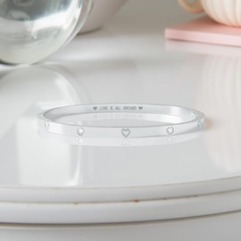 Peach Bomb Women's Silver Bangle Bracelet with Cubic Zirconia Round Sparkling Stones and Heart Details. Love is All Around Message Engraving on Inside. Gift Box Included (Bangle)