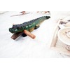 Guiro music percussion instruments wooden sound block animal croaking Alligator