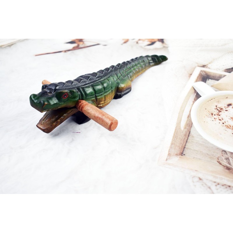 Guiro music percussion instruments wooden sound block animal croaking Alligator