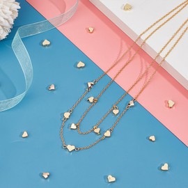 UNICRAFTALE - 60 abalorio de corazón de metal lisas con abalorio espaciadoras chapadas en oro, abalorio sueltas de corazón con agujeros pequeños, abalorio espaciadoras de latón para hacer collares,