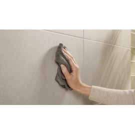 tesa MOON toilet paper holder in brushed graphite - self-adhesive roll holder without lid, made of PVD-coated metal - drill-free, incl. adhesive solution - 99 mm x 140 mm x 53 mm