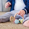 Hape Racing Turtle Rike Rolling Toy with Teether from 10