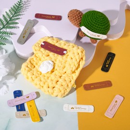 Pandahall 100Pcs Handmade with Love PU Leather Labels Hand Made Embossed Clothing Tags with Holes Embellishments DIY Accessories for Sewing Knitting Crocheting Jeans Hats Bags Garment Decor