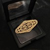 Elegant Gold - toned Oval Shaped Filigree Brooch with Crystal
