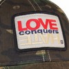 Cap Love Conquers Hate Camo