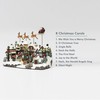 MOMENTS IN TIME 10.5”H Polyresin Christmas Village with Music and