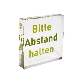 Transparent acrylic block as information stand, note stand with imprint "Bitte Abstand halten" in the colour lime, information stand made of original Plexiglas