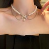 Vacaonio Boho Layered Pearl Choker Necklace Rhinestone Bow Necklace Silver