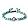 COAI Pulsera de piedra con abalorio de mal de ojo,