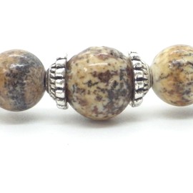 Damenarmband aus braunen Jaspisperlen und tibetischen Perlen