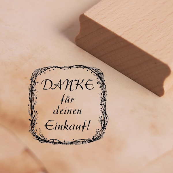 Wooden Stamp with German Text "Danke für deinen Einkauf [German