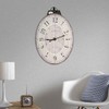 Benjara Distressed Oval Shape Wooden Wall Clock with Ring Hanger,