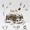 MOMENTS IN TIME 10.5”H Polyresin Christmas Village with Music and