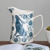 Creative Co-Op Stoneware Pitcher with Painted Rabbit and Florals, Blue