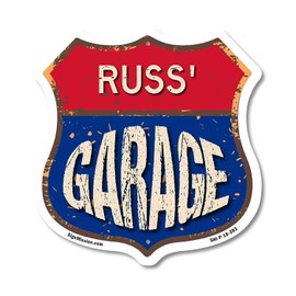 Russ's Garage 18 inch X 18 inch Shield Shaped Commercial Grade Plastic Sign Weather Resistant, UV Protected To last, Gift for Dads and Uncles Classic Americana Crafted in the USA