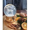 Snow globe deer white on base copper gold snowflakes with